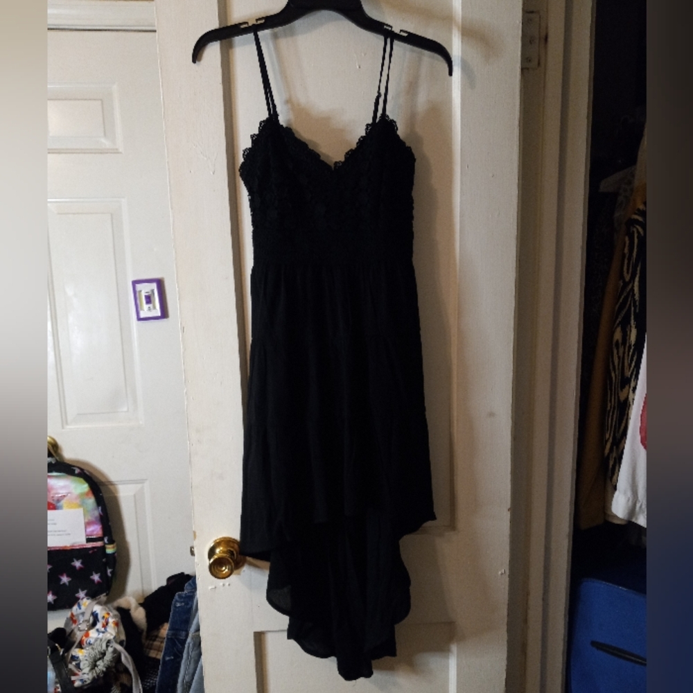 Black midi dress, longer skirt in the back.